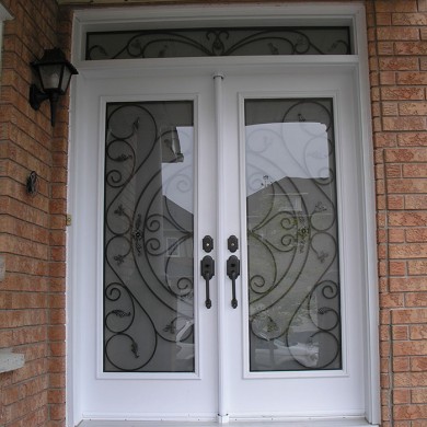 Wrought Iron Double Doors with Transom Installed by Four Seasons Windows & Doors-Out Side View