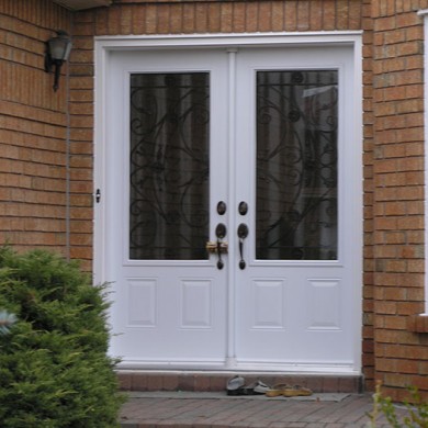 Wrought Iron Duoble Doors Installed by Four Seasons Windows & Doors